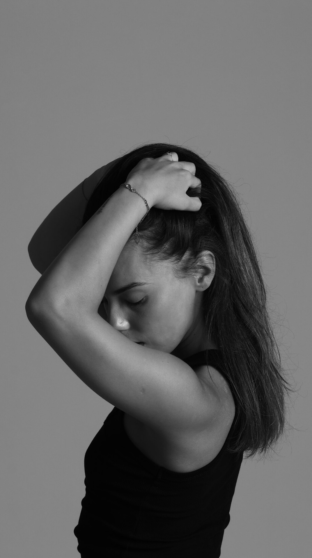 Young woman with brown hair portrait in studio