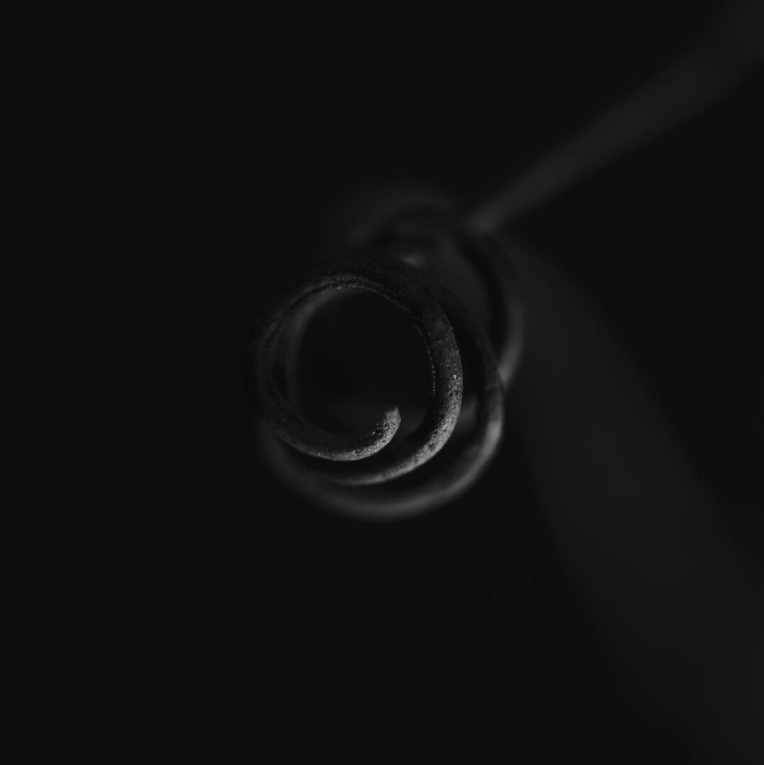 Stethoscope on a dark surface in a medical setting