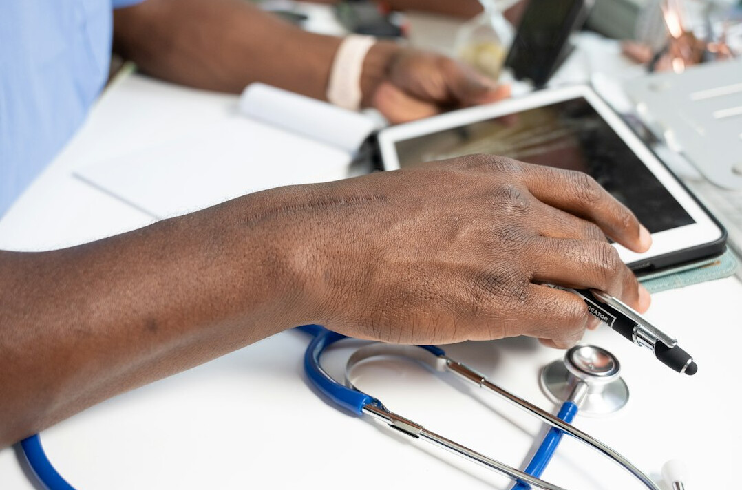 doctor using digital tablet
