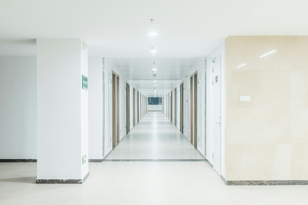 Modern hospital building interior with a long hallway
