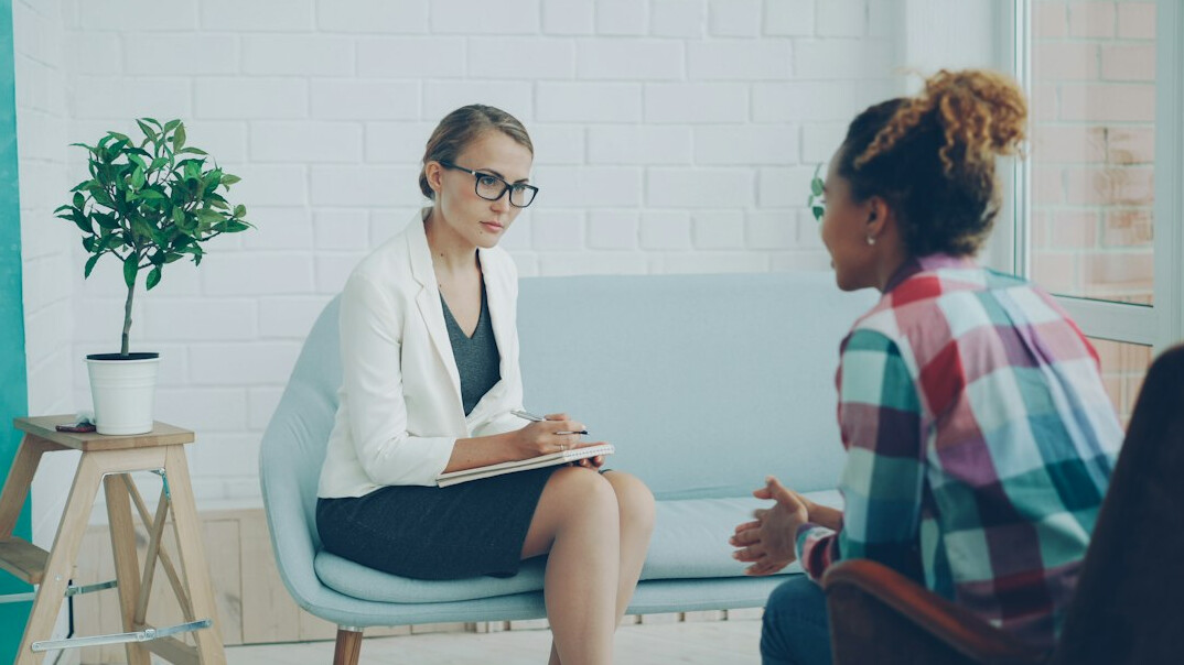 health trainer with patient in modern clinic