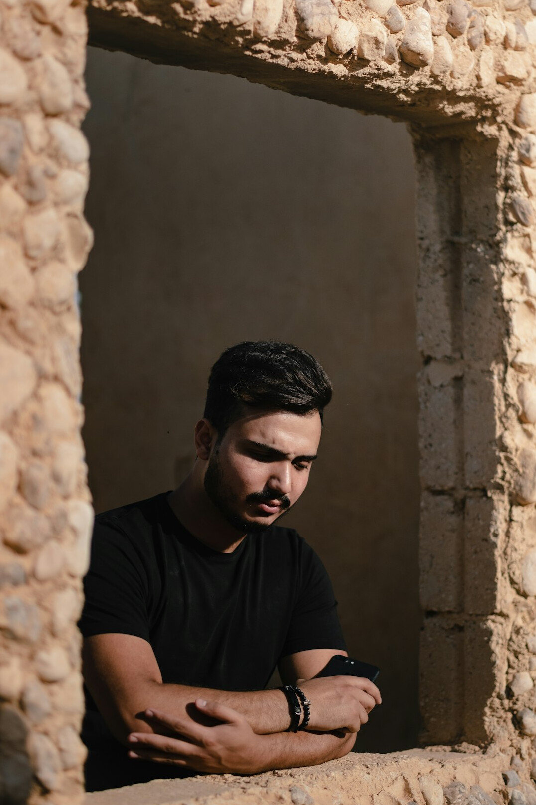 Man with a short beard in a dark shirt portrait