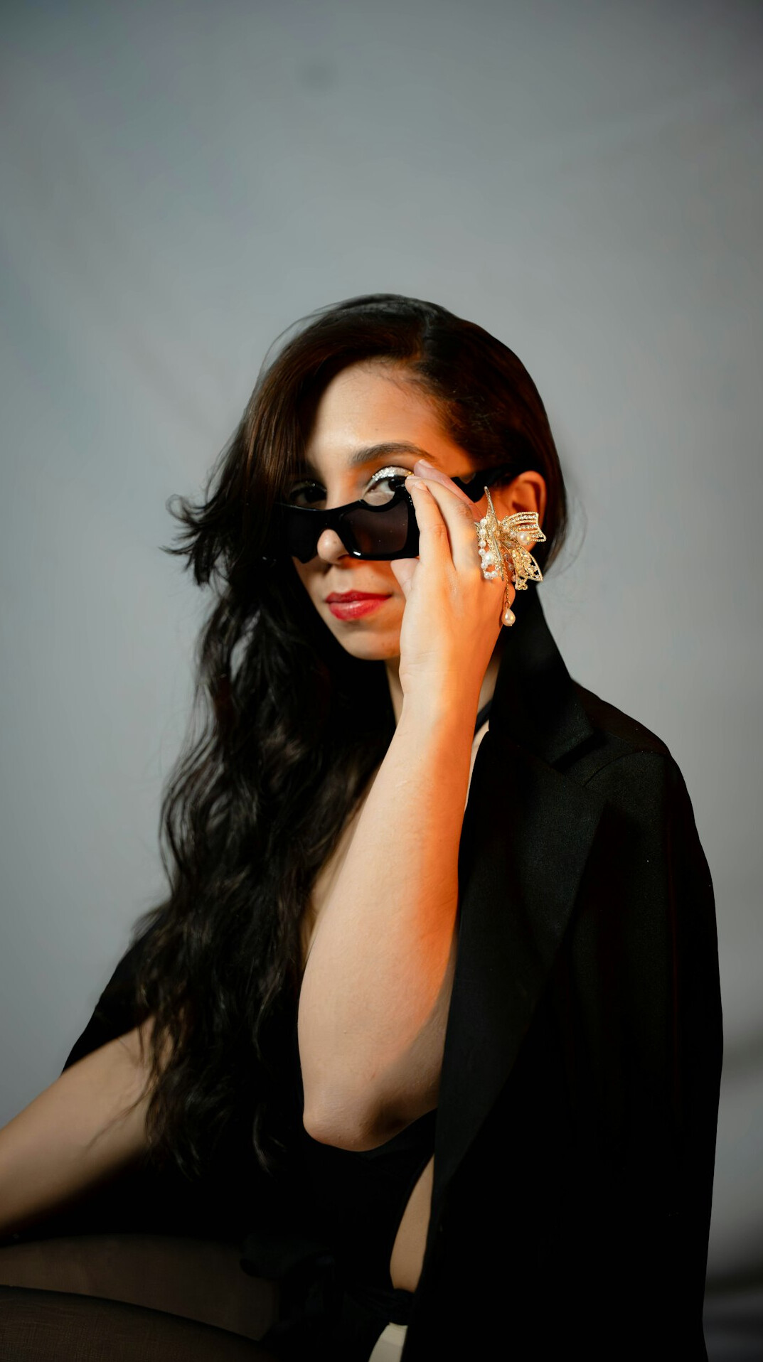 Woman in a black blazer with dark hair portrait